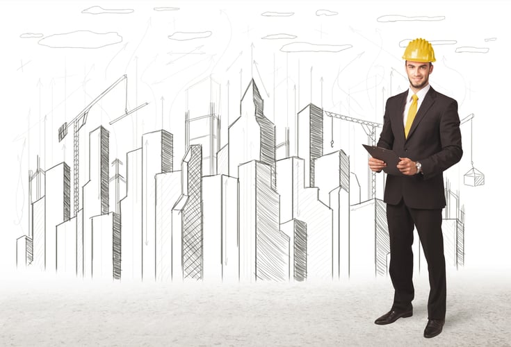 Engineer man with building city drawing in background-1